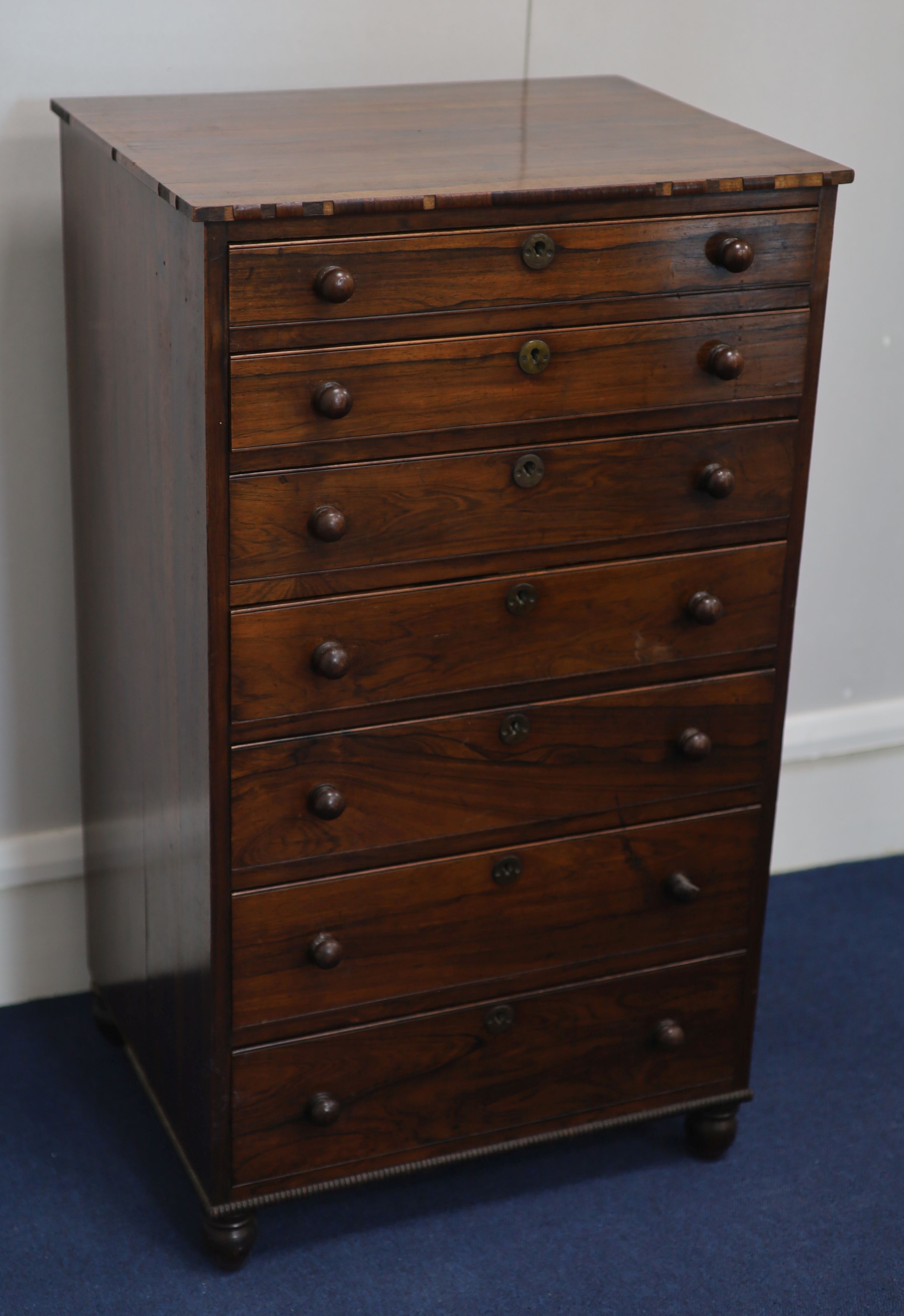 An early Victorian rosewood collectors chest W. 50cm. D. 39cm. H. 87cm.